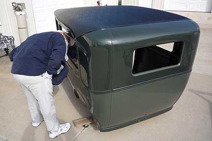 Larry Kehler checks out Terry Oberer's 1930 Model A Tudor